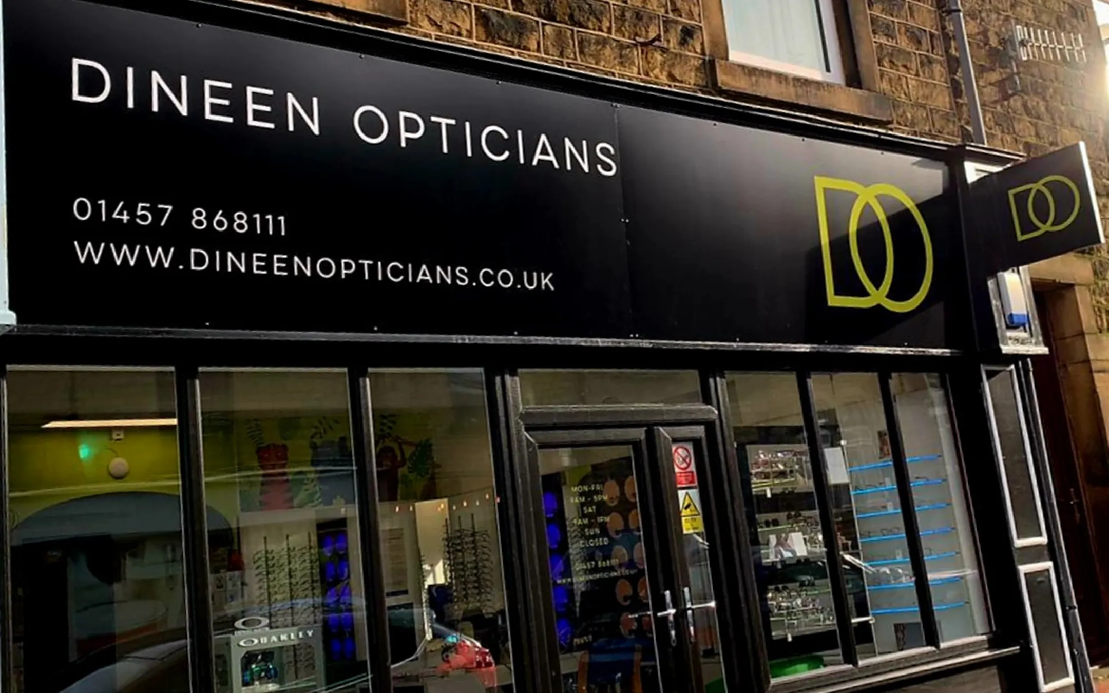 Dineen Opticians independent optometry practice storefront with contact details and eyewear displays