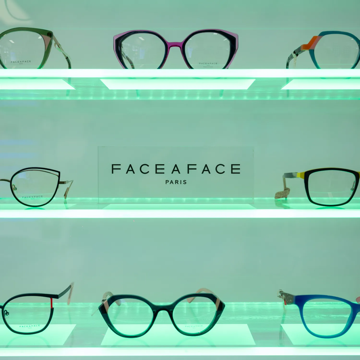 Face a Face Paris eyewear collection featuring colorful designer frames on backlit display shelves
