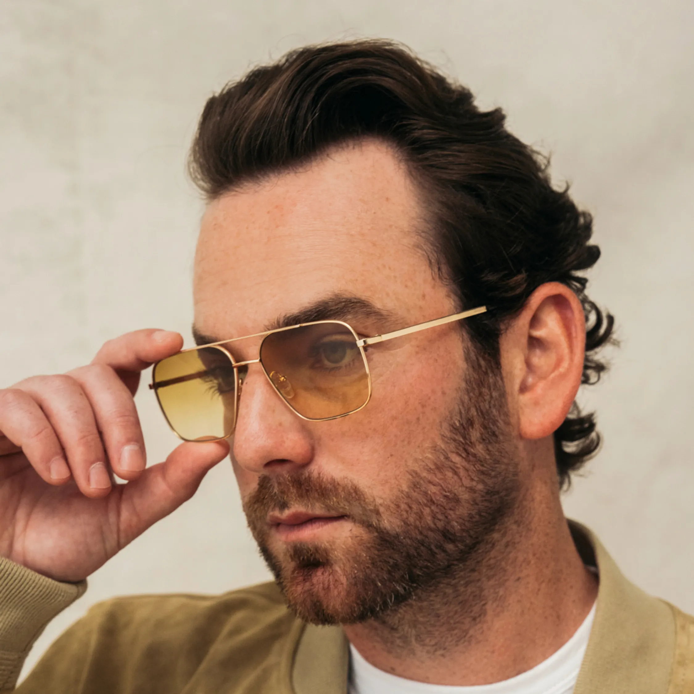 Moscot aviator sunglasses with gold frames and gradient lenses - designer eyewear collection