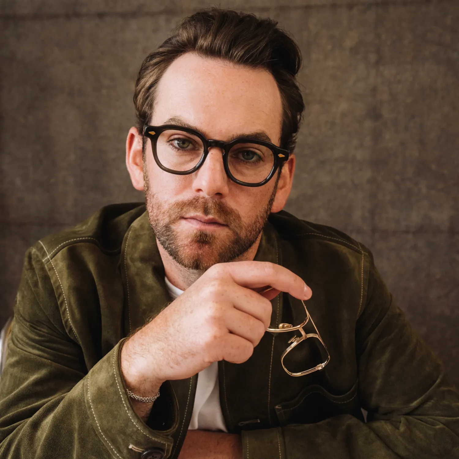 Customer trying Moscot prescription eyeglasses during personalized frame selection consultation