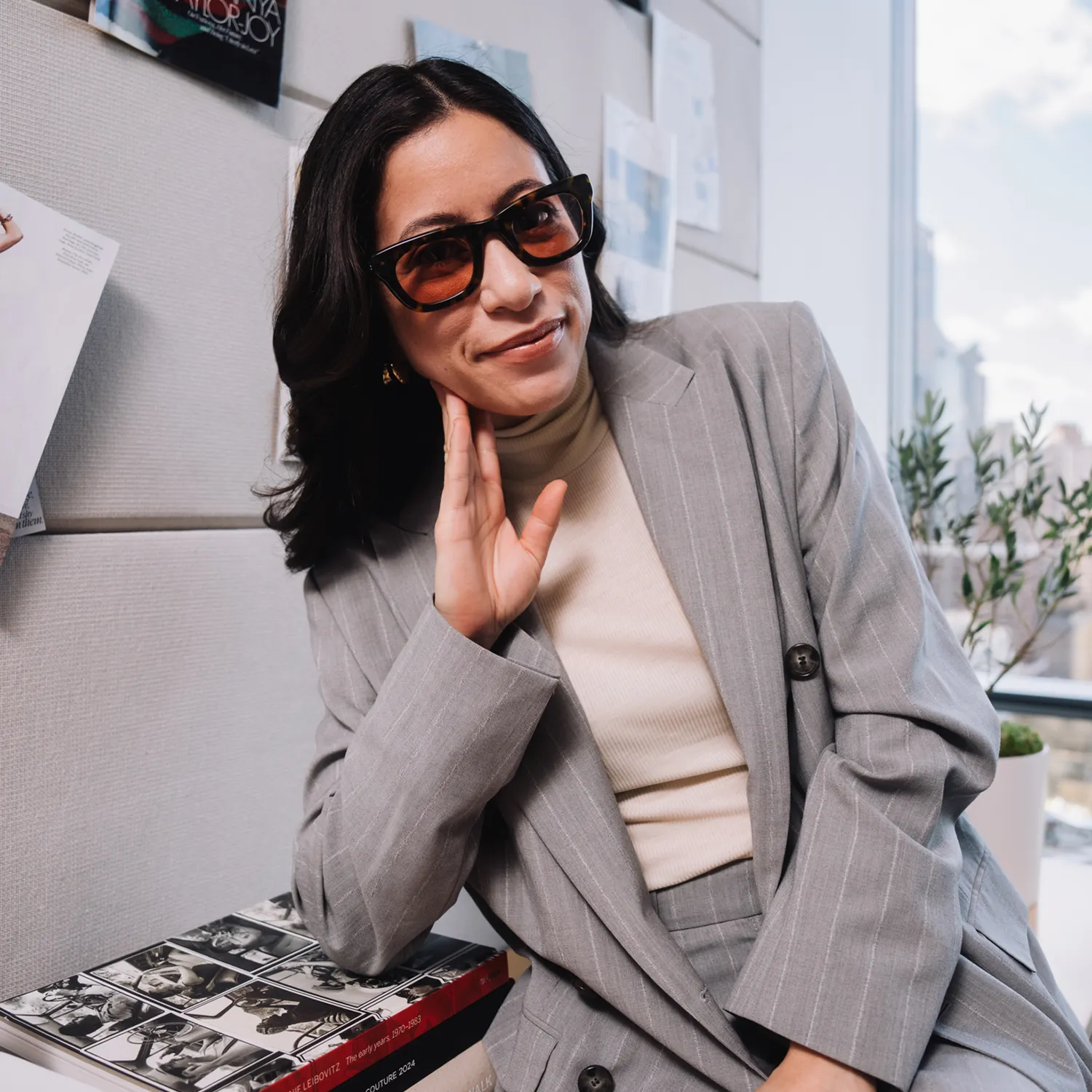 Professional wearing Moscot designer sunglasses with ongoing eyewear aftercare and adjustment services