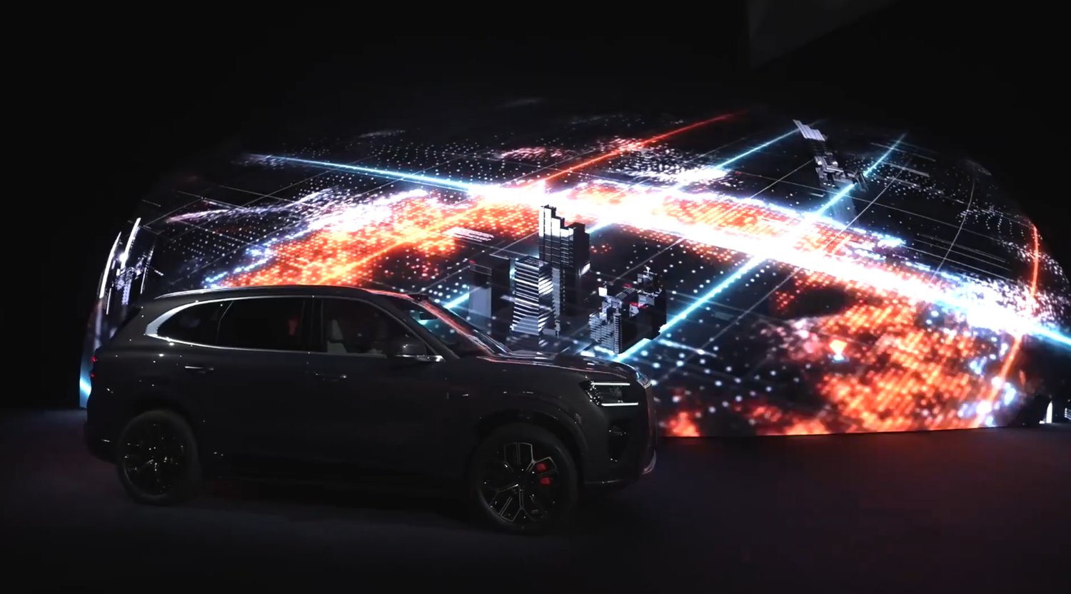 ZEEKR 8X launch event featuring a sphere-inspired LED dome installation with red and orange curved LED panels surrounding the vehicle