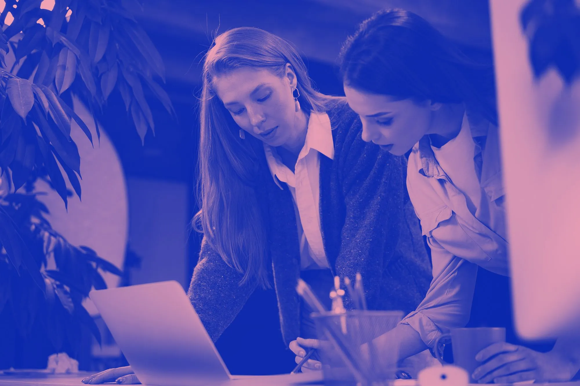 Two woman working together