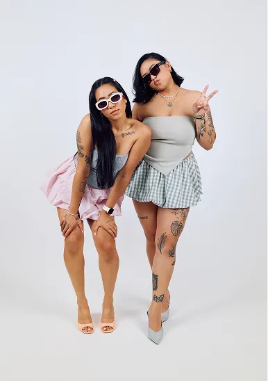 Family with a baby sitting on the floor in studio