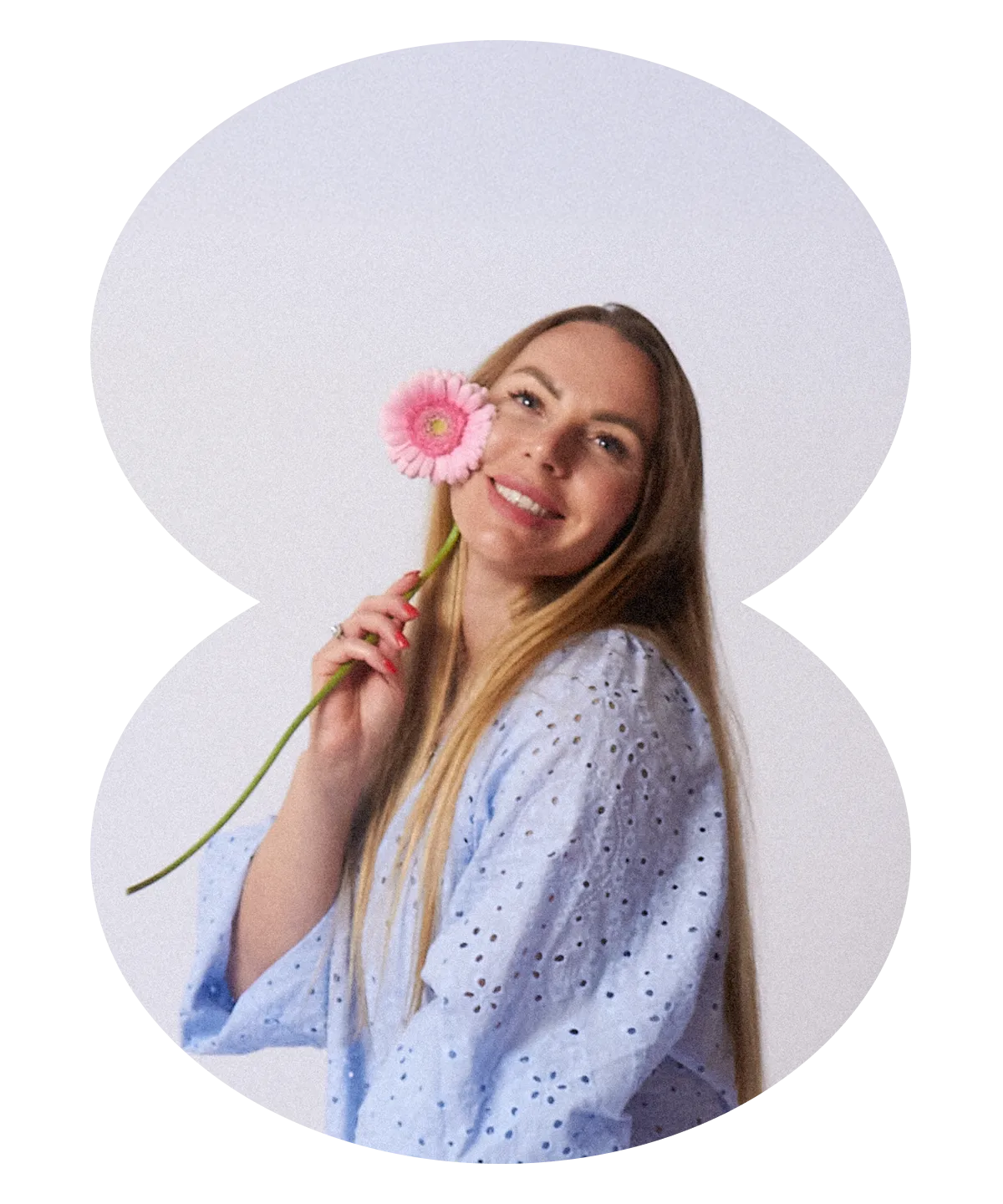 Olya — CEO & soul of Click Click, holding a pink flower