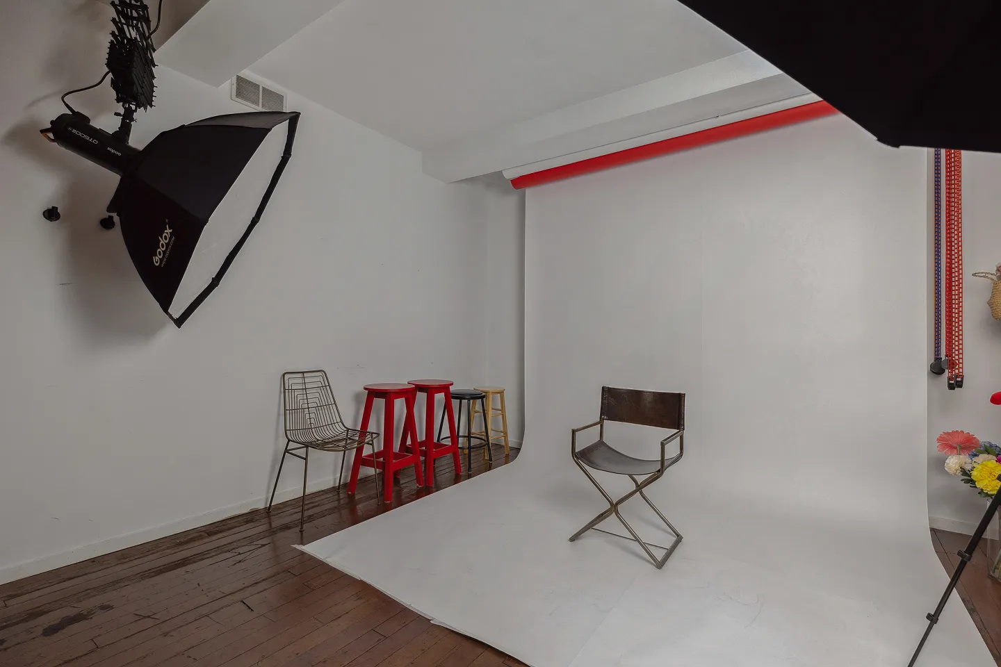 Professional photo studio with white seamless backdrop and studio lighting at Click Click in Gastown, Vancouver