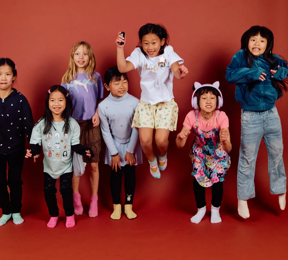 Child posing for a self-portrait studio photo at Click Click