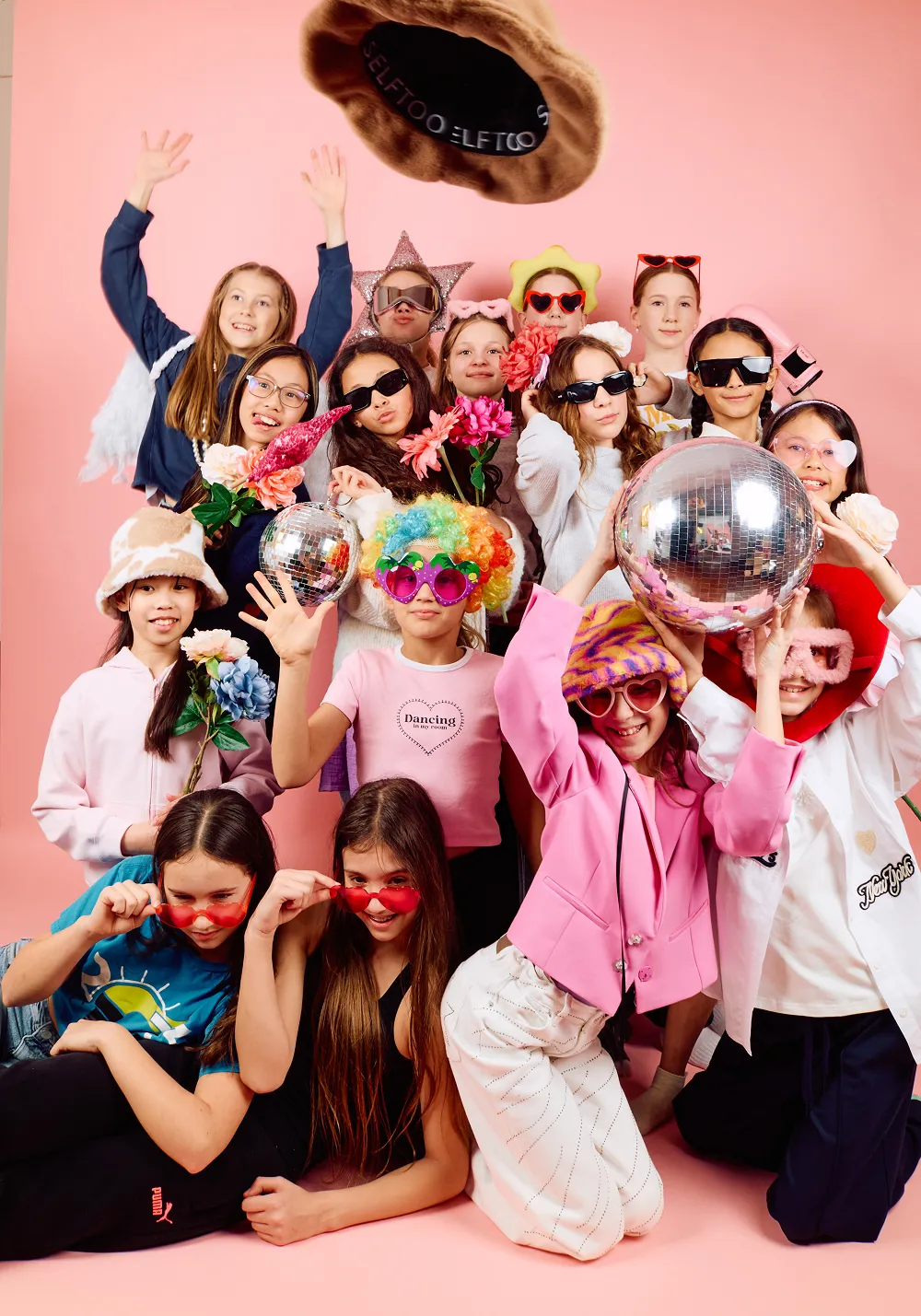 Kids celebrating a birthday with playful props at Click Click Vancouver