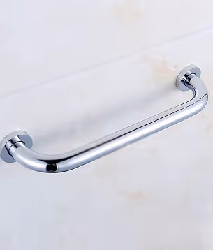 Shiny chrome grab rail mounted horizontally on a light-colored tiled wall.