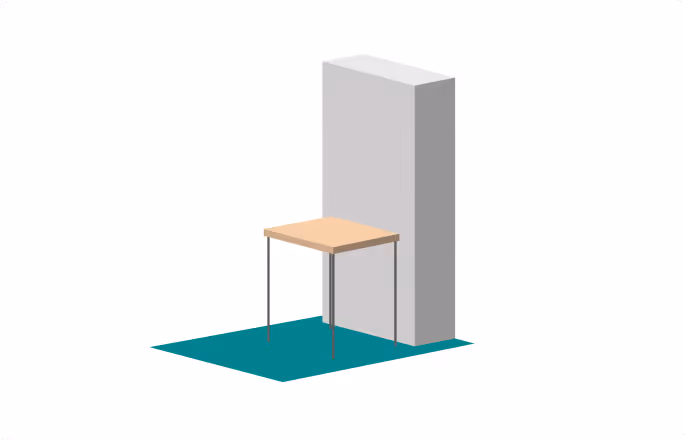 Table en bois avec quatre pieds fins devant un mur gris sur un tapis bleu-vert.