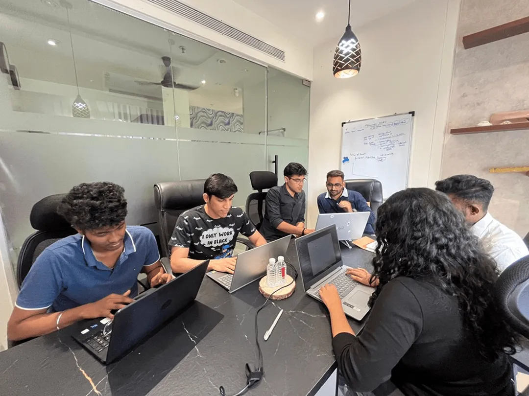 Metaminds Studio team engaged in a collaborative group discussion, brainstorming ideas and sharing insights.