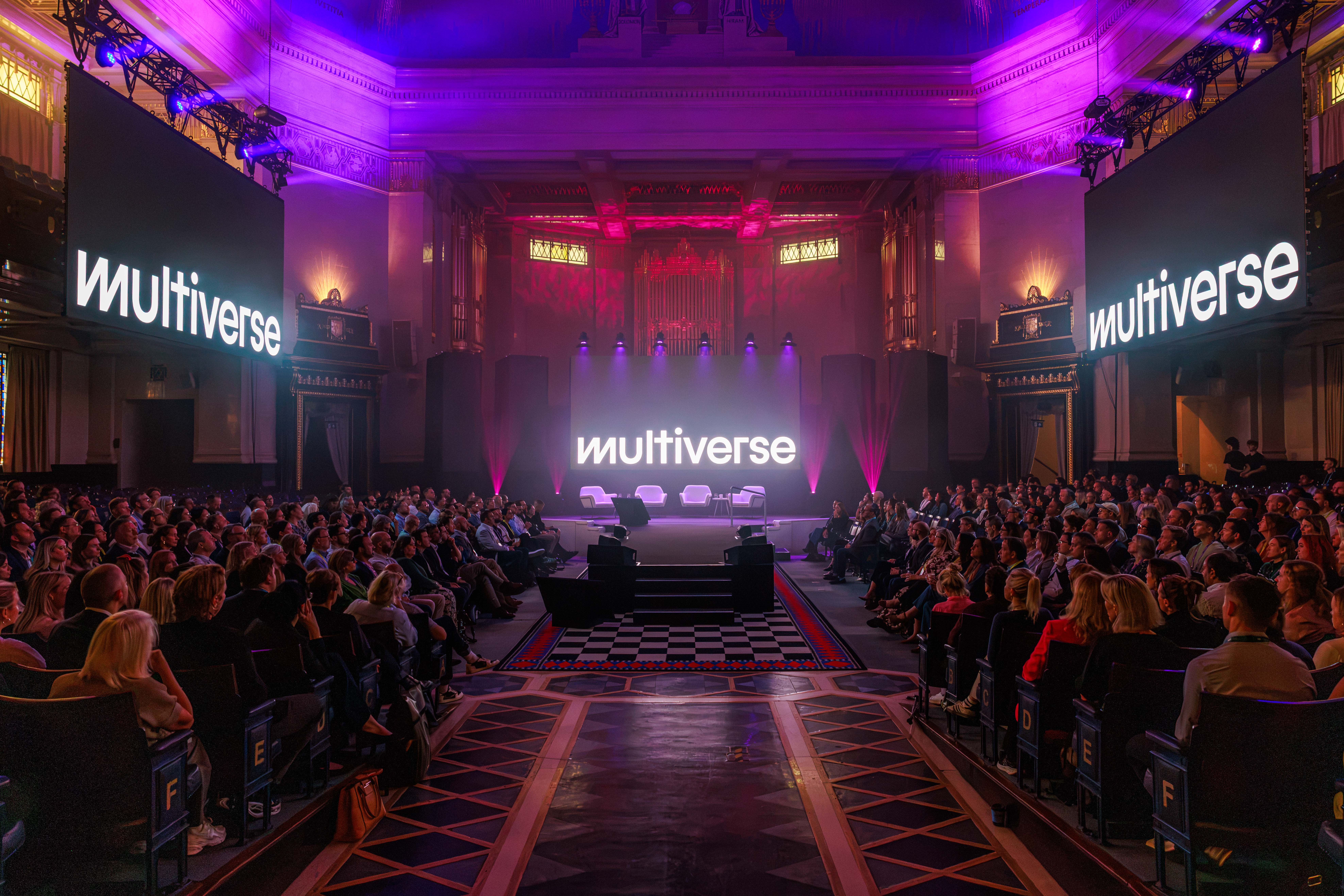 Multiverse logo on a big screen in front of a stage at Workforce 2030 conference