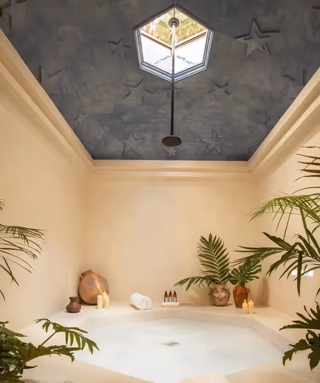Minimalist bathtub under a geometric skylight at La Valise San Miguel Hotel.