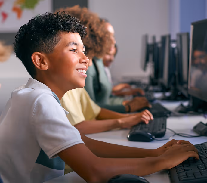Housekeeper adjusting pillow on a neatly made bed in a softly lit room.