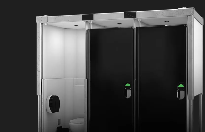Restroom trailer section with one open stall showing toilet and paper dispenser and two closed black doors
