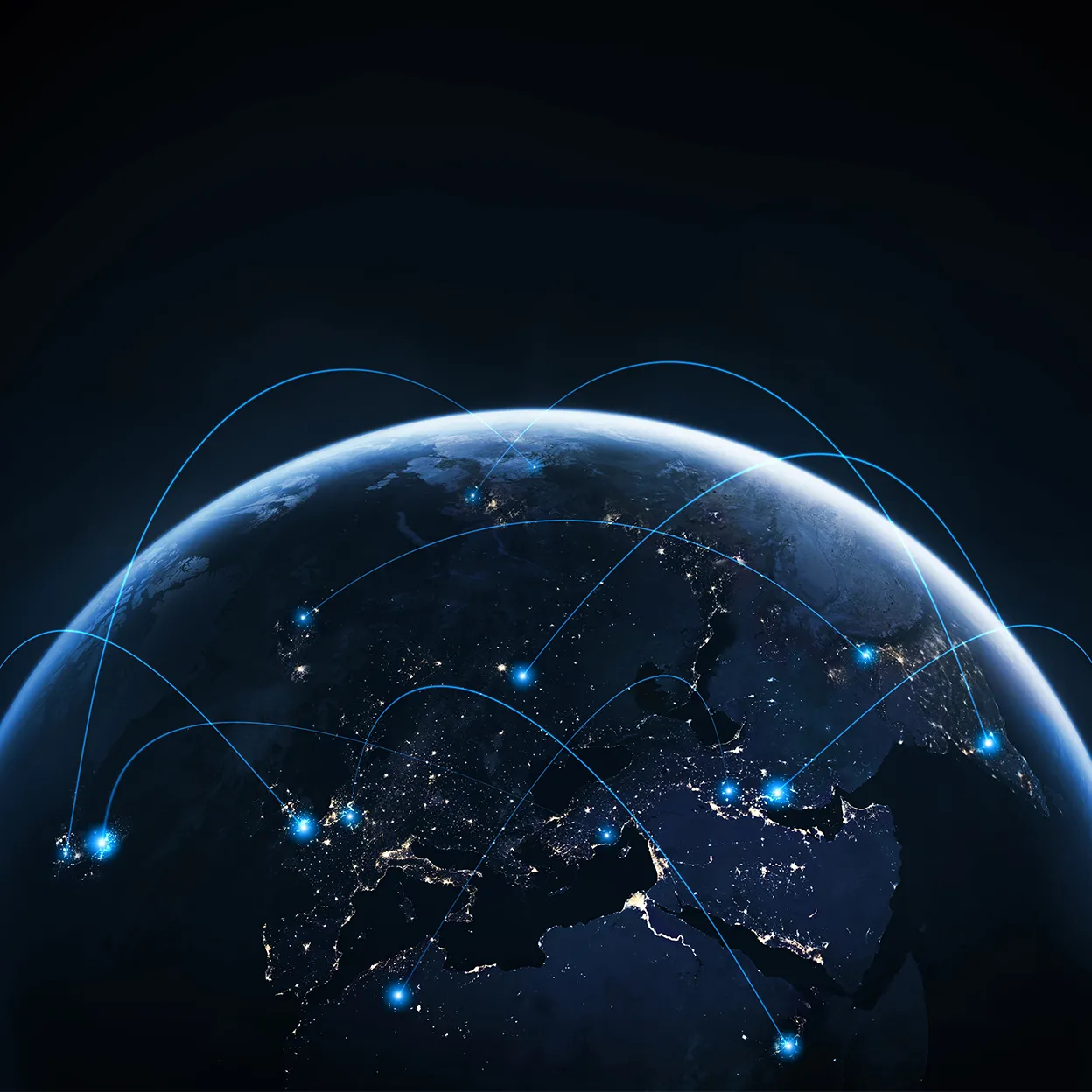 Globe at night with illuminated cities and blue arcs connecting various locations