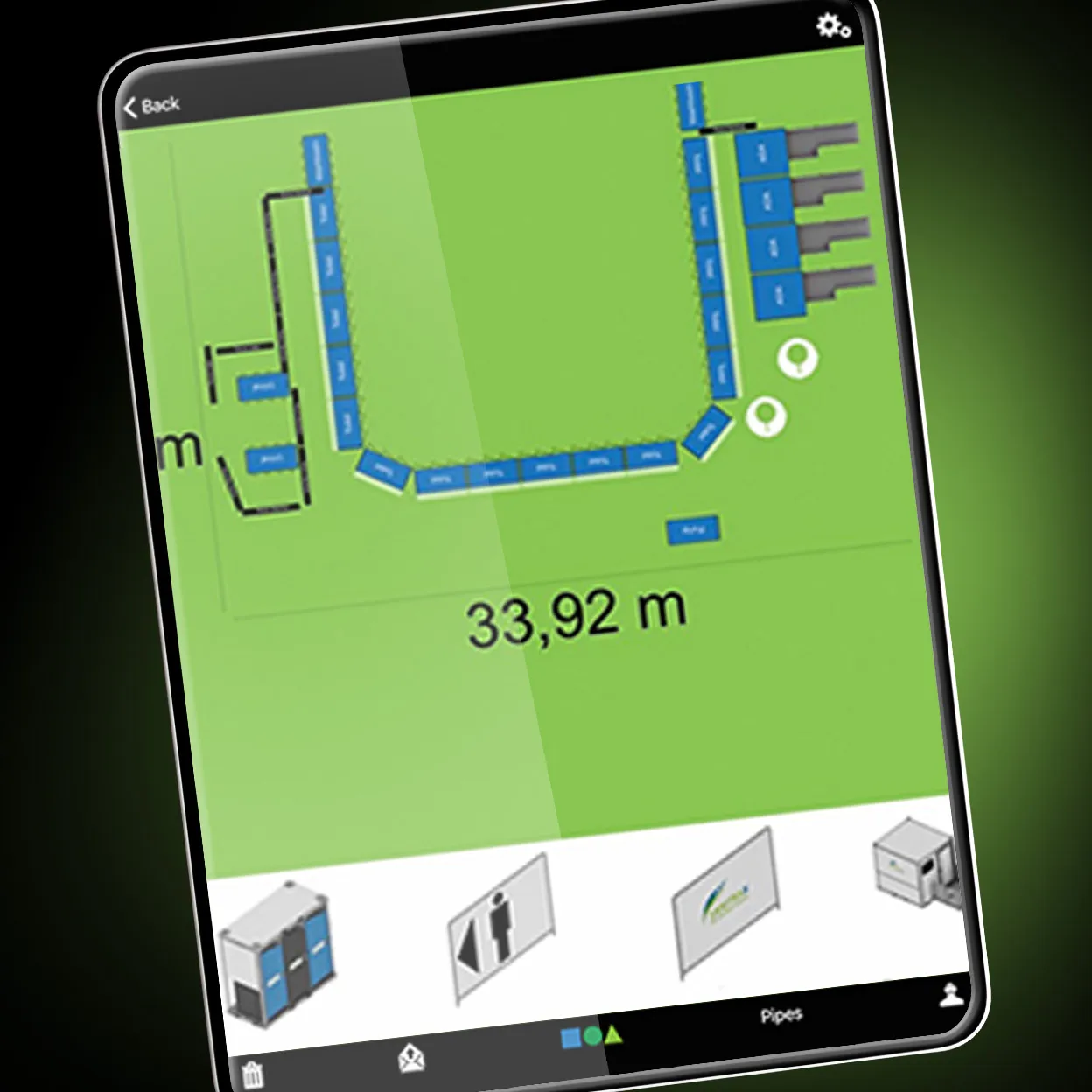 Tablet screen showing a digital site layout with blue portable sanitation units arranged around a green area and labeled with 33.92 meters length measurement