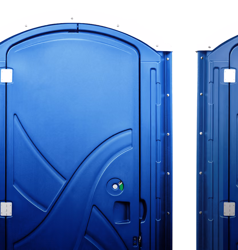 Close-up of a blue portable toilet door with a white top and a female restroom symbol.