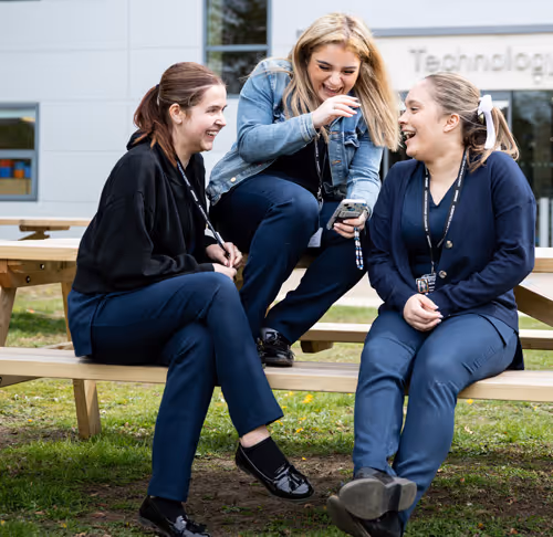 Three college students talking and enjoying college