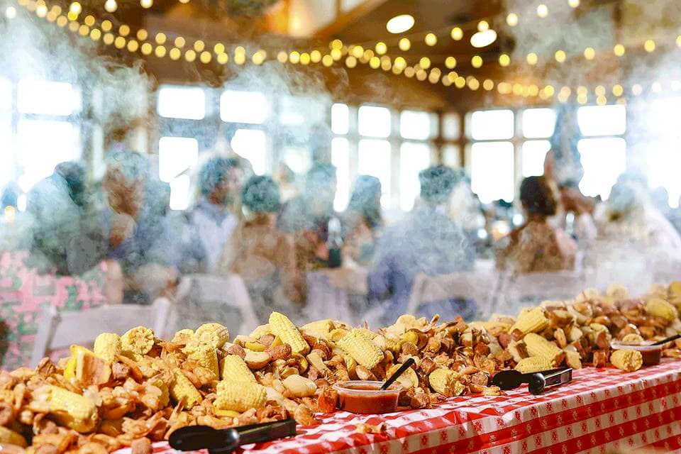 Outer Banks Boil Co Seafood Boil display at a Jennette's Pier wedding