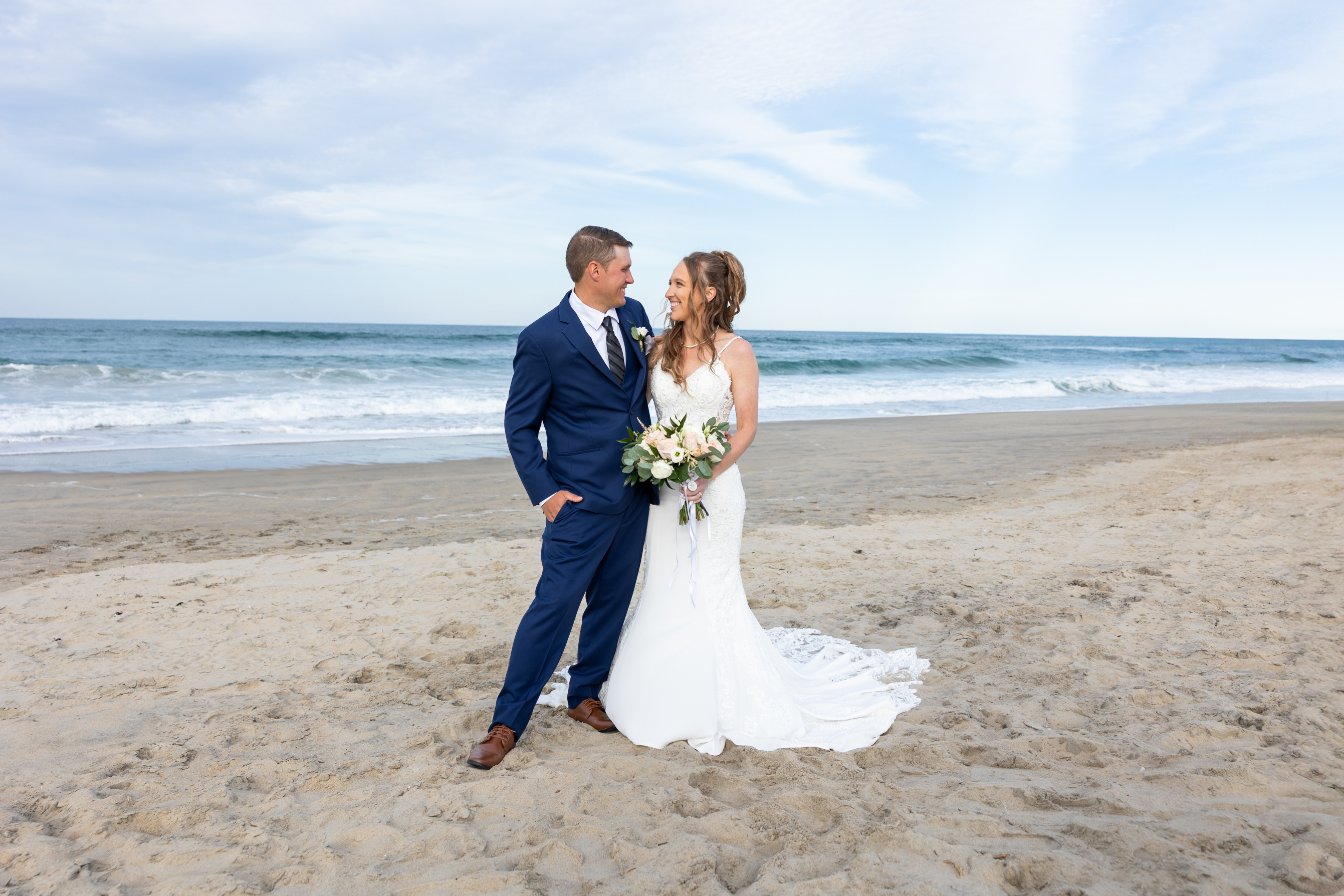 Bride and groom on the beach after their Outer Banks ceremony