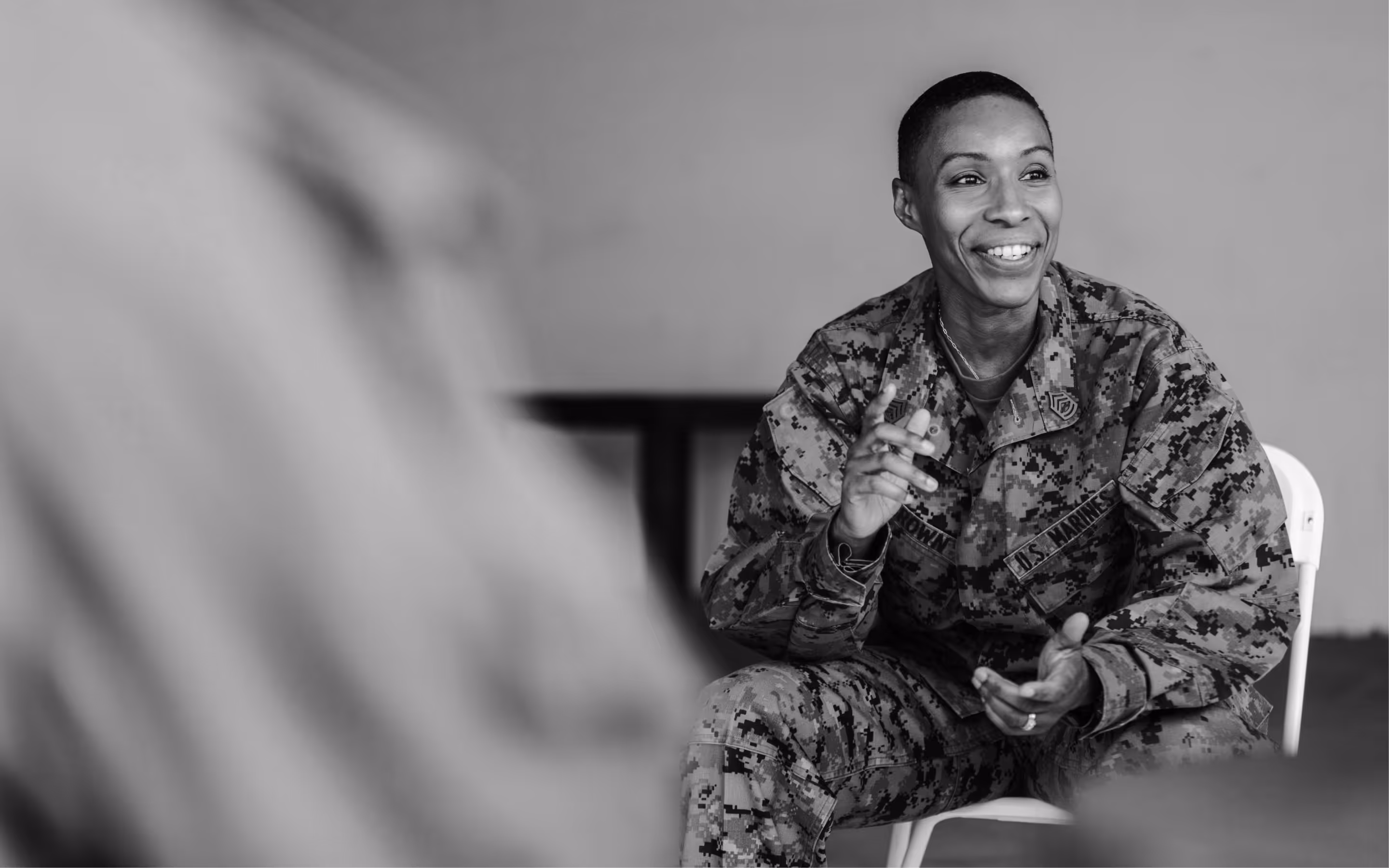Two women smiling while wearing outdoor gear