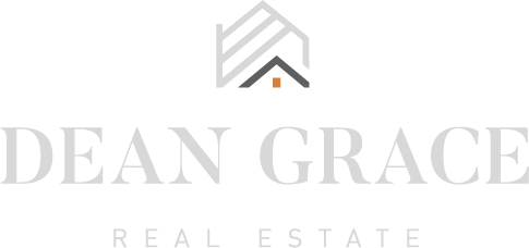 Logo for Dean Grace Real Estate featuring a stylized house roof above the text.