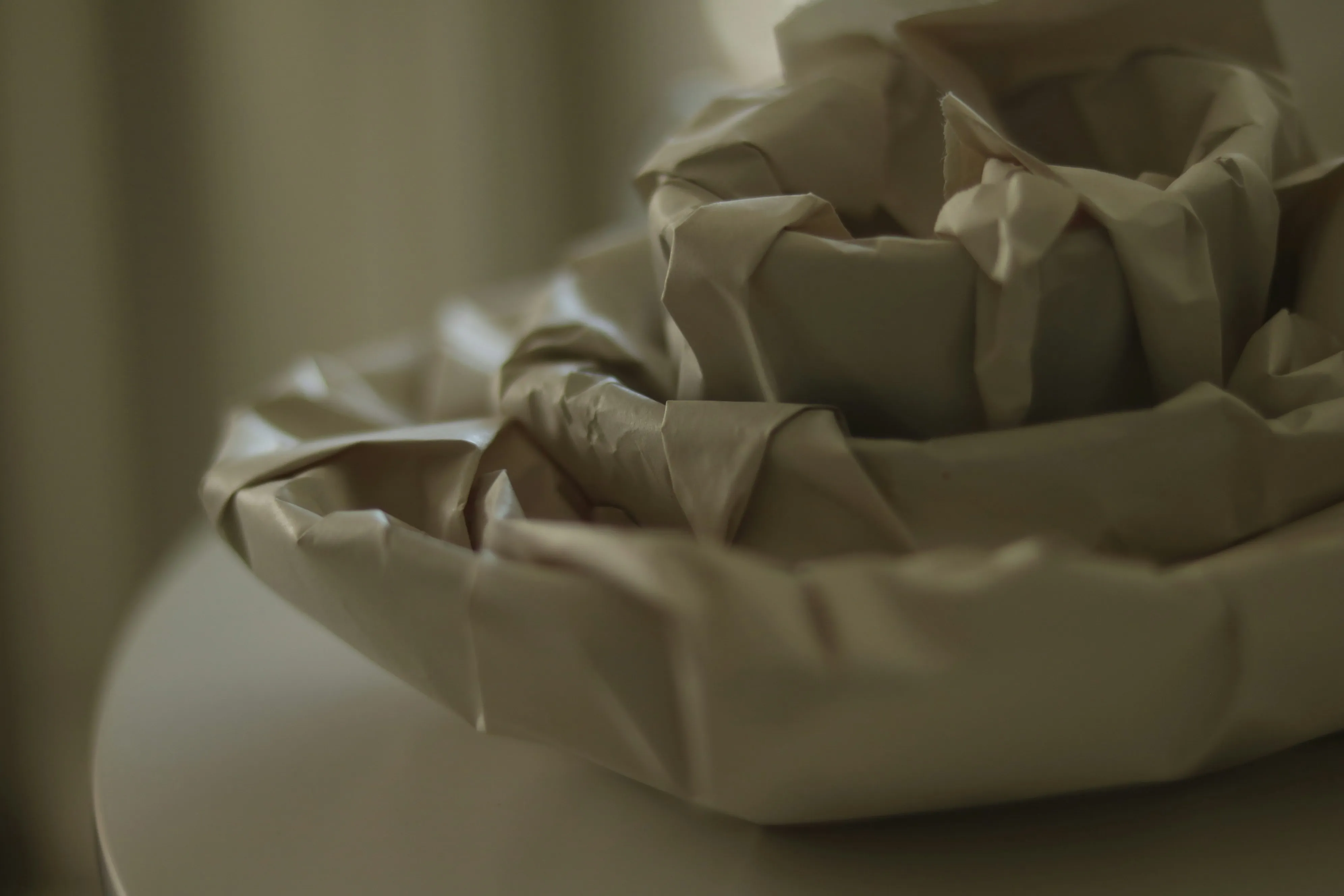 image of dishes wrapped in paper to prevent them from breaking