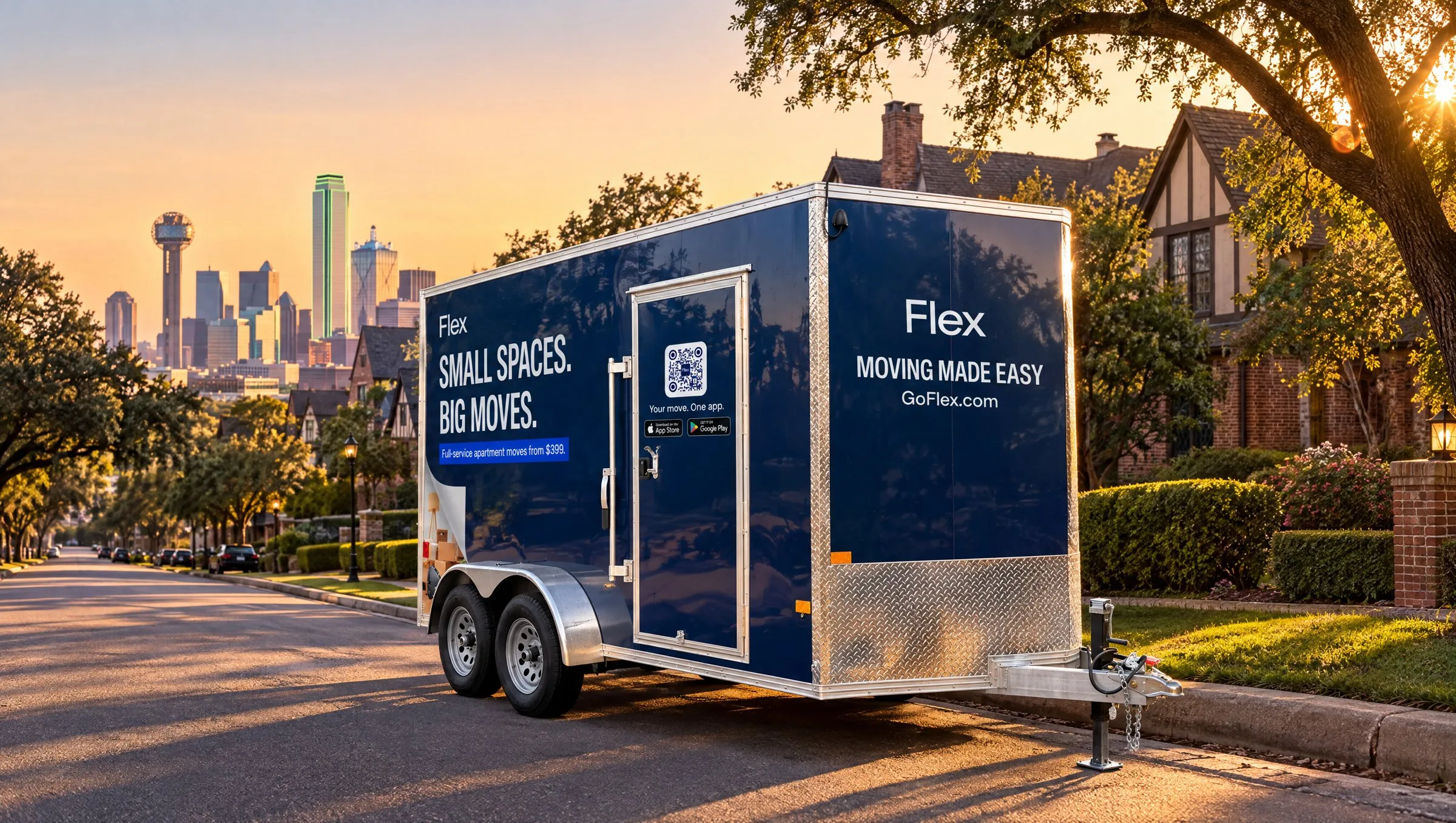 A navy Flex moving trailer parked on a city street at sunset