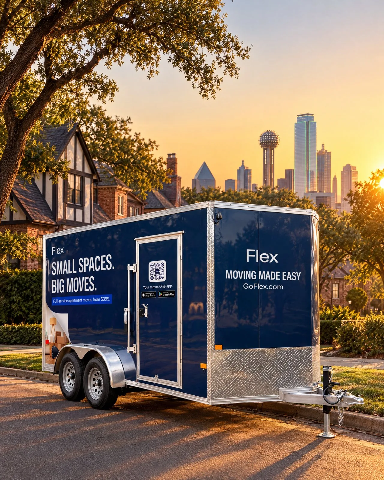 A navy Flex moving trailer parked on a city street at sunset