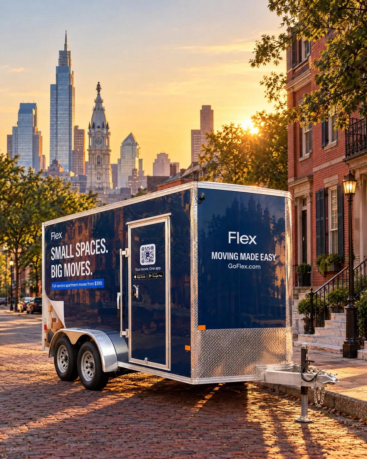 A navy Flex moving trailer parked on a city street at sunset