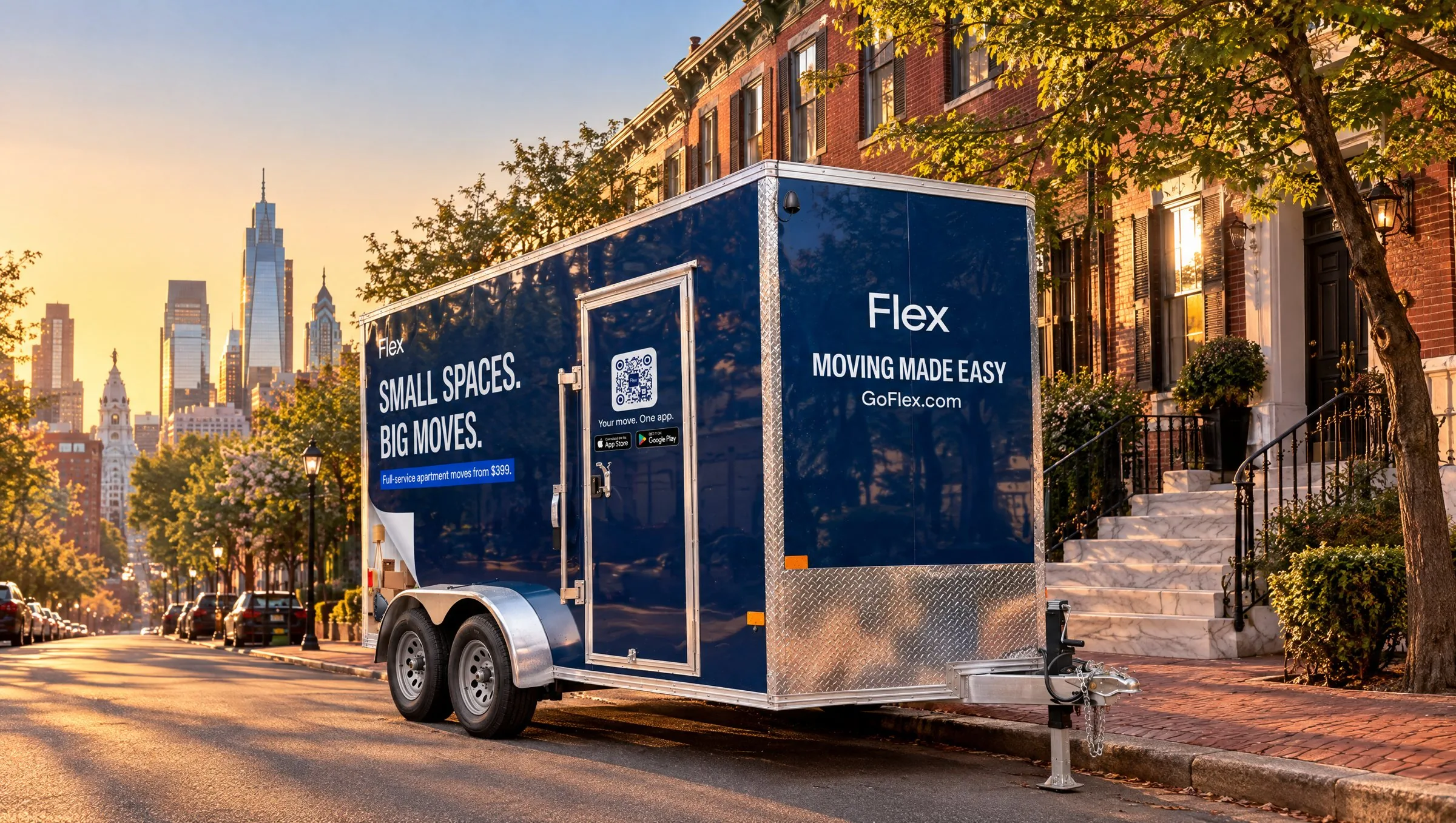 A navy Flex moving trailer parked on a city street at sunset