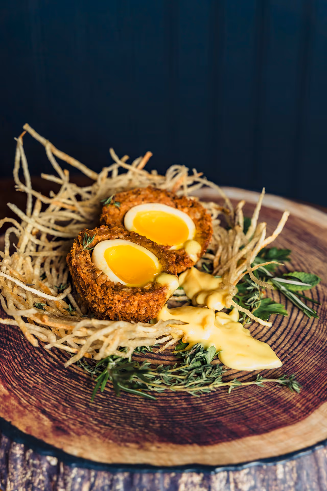 A close up of a food item with a yellow yolk.