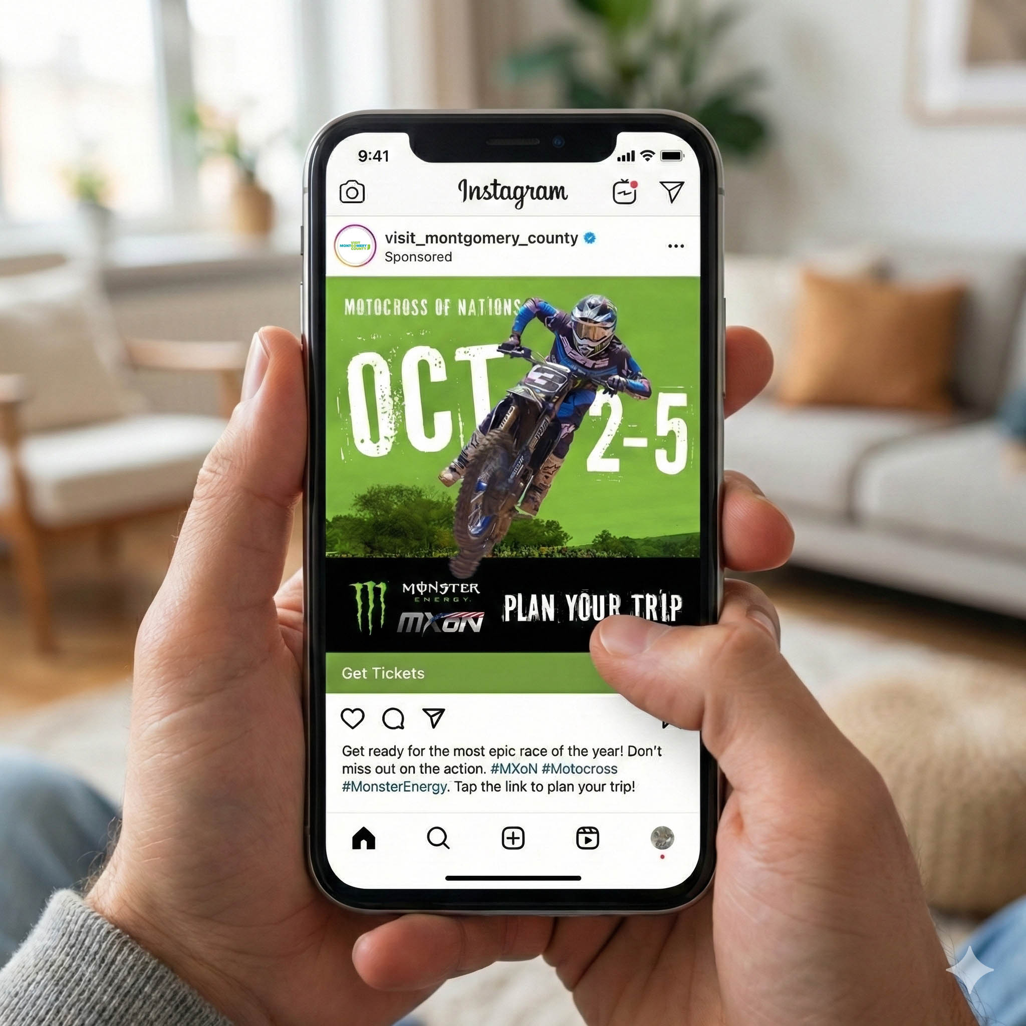 Someone is looking at an Instagram ad on their phone for the Motocross of Nations event. In the ad, a motocross driver is mid-jump