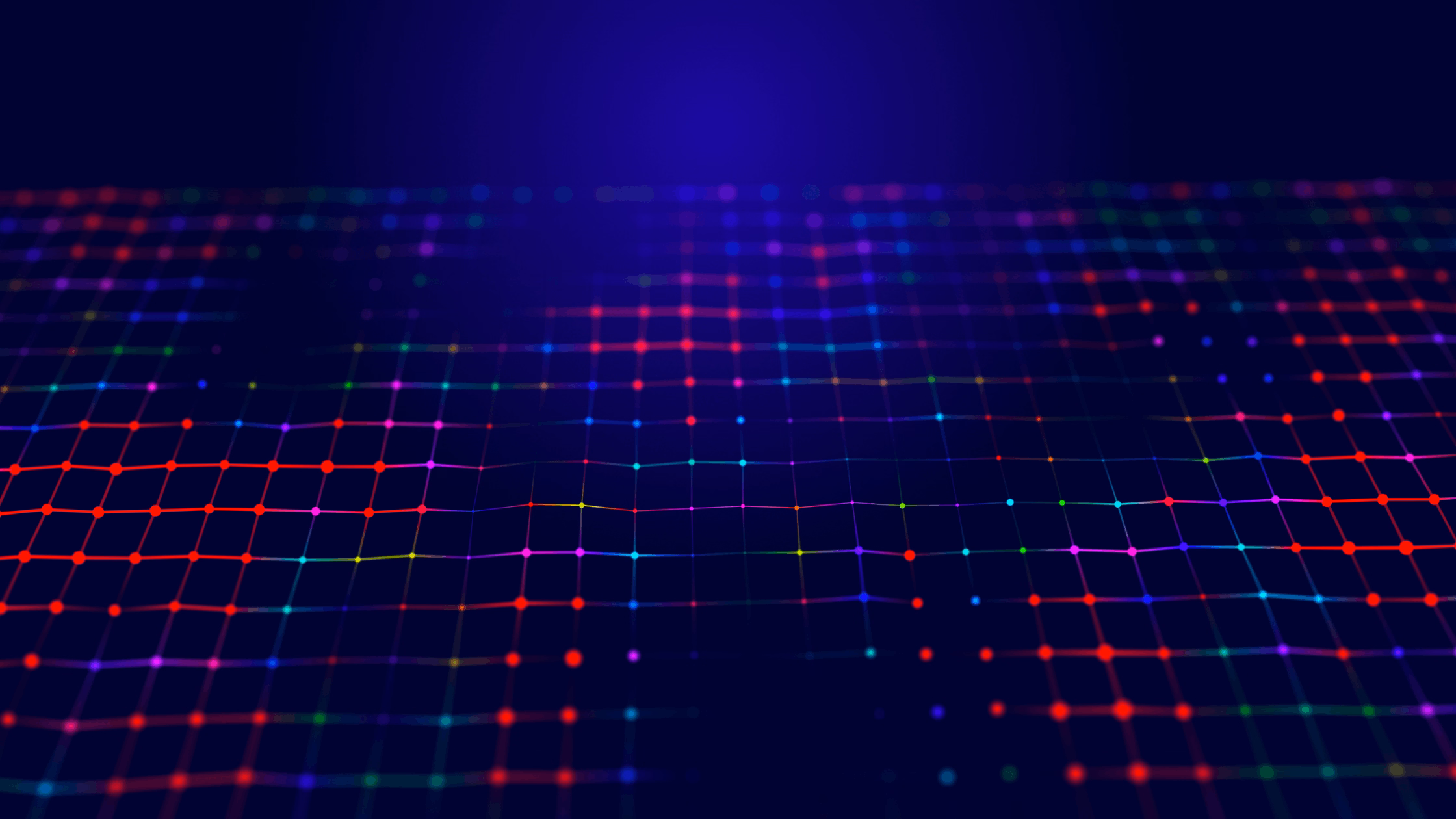 Colorful digital mesh grid with multicolored dots (red, green, blue, yellow) connected by lines forming a wave pattern against a dark purple background