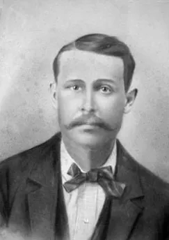 Black and white portrait of a man with short hair, mustache, bow tie, and suit jacket.