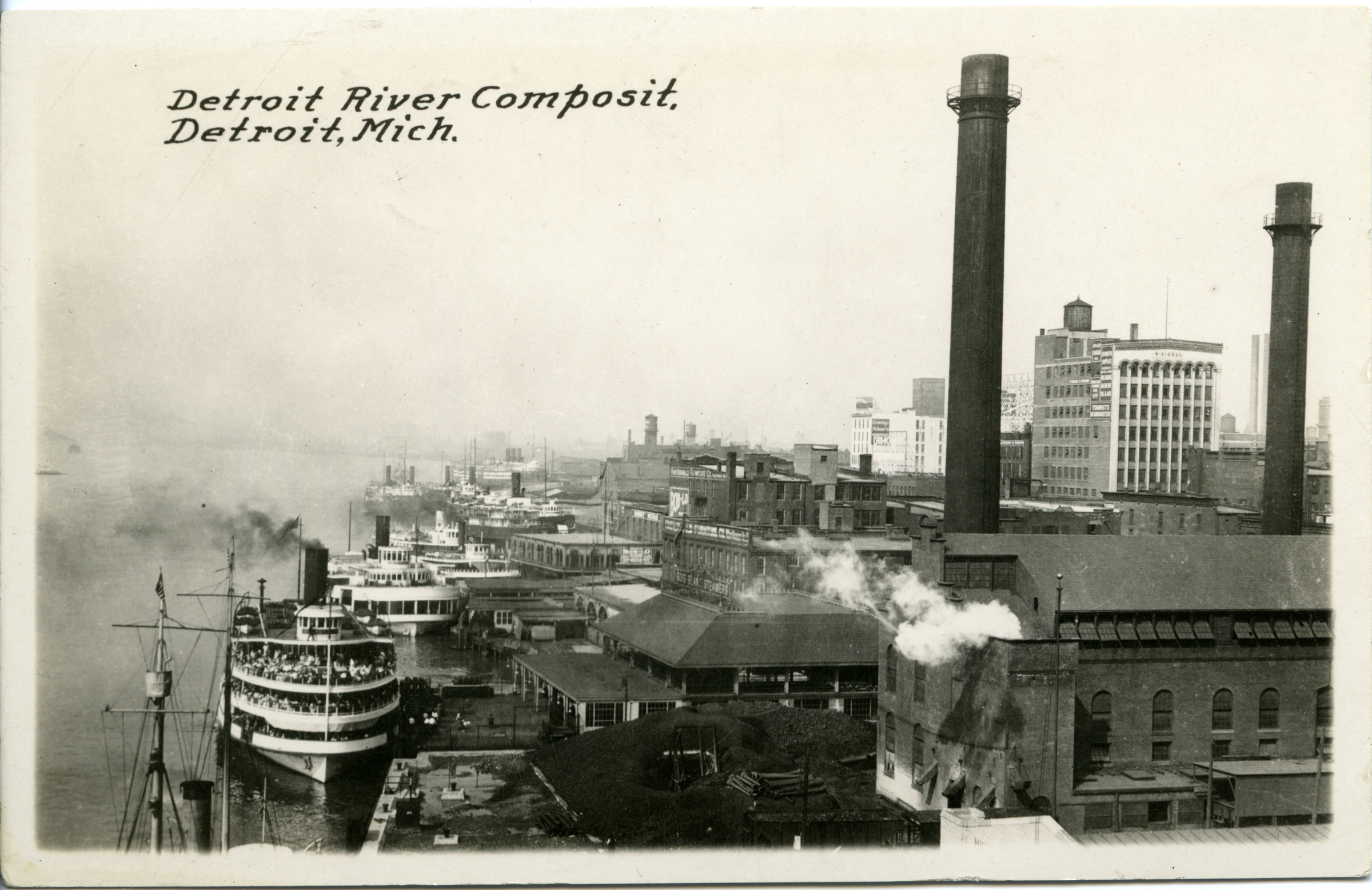 Historical photo of riverfront parcels converted to factories and other industrial buildings.