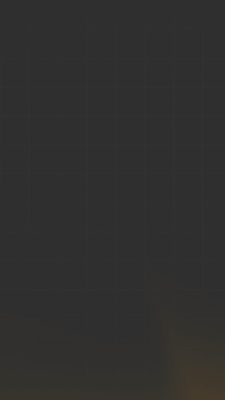 Person walking toward a large abstract golden dragon sculpture under a blue sky in a city square.