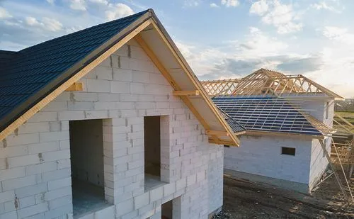 house in build stage with tile roof