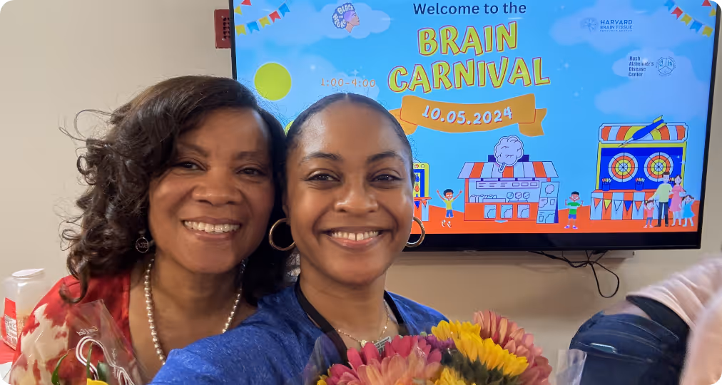 Two people at a Black in Neuro outreach event 