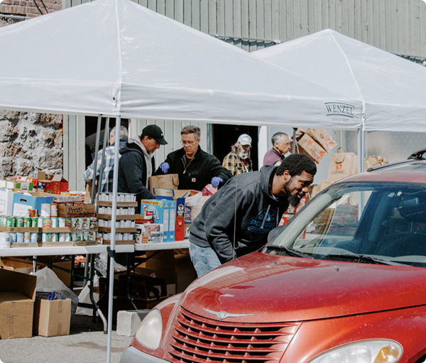 Picture of volunteers helping hand out food