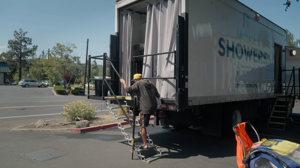 Person using shower truck services