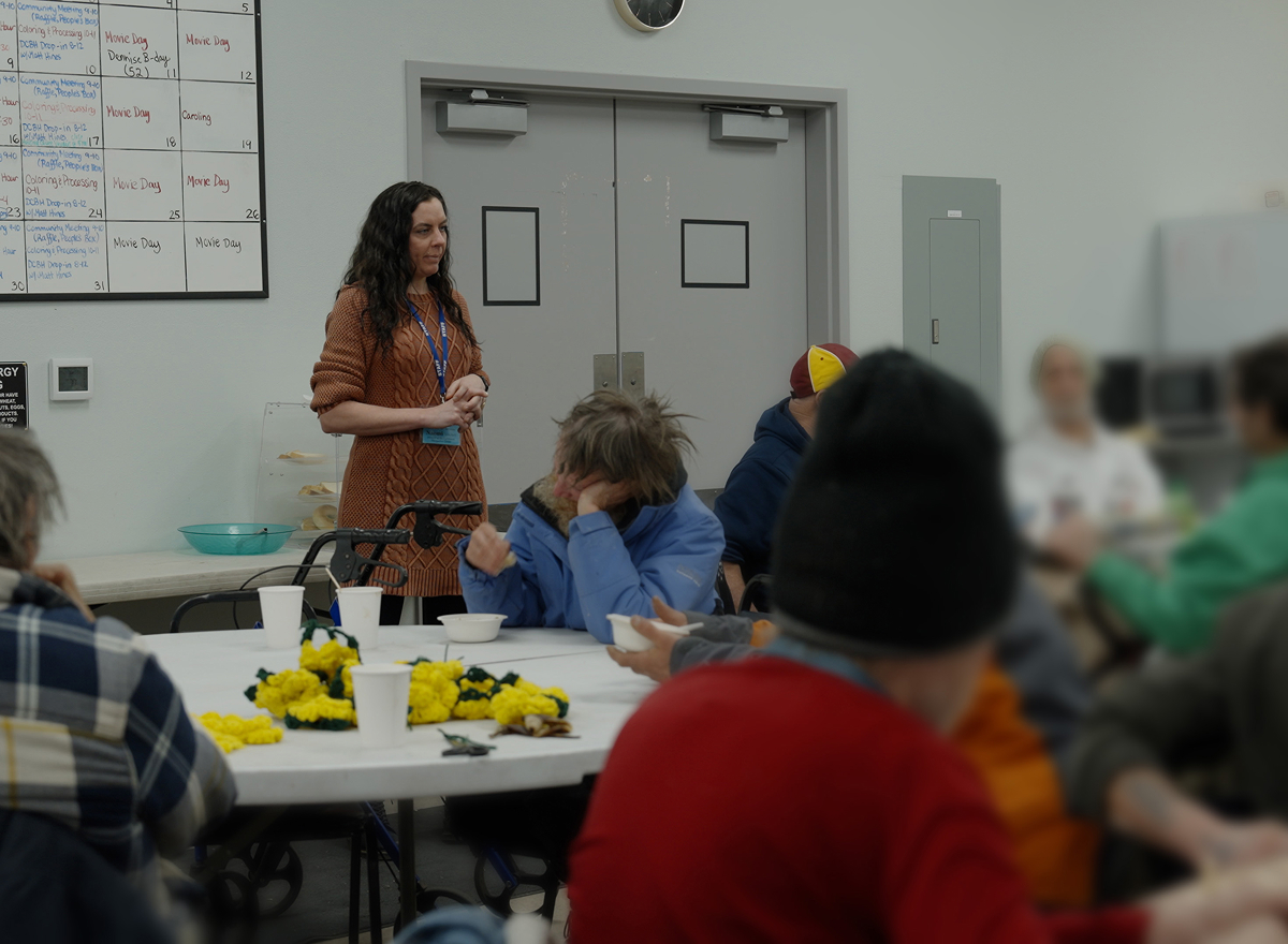 Volunteers with a tray of food