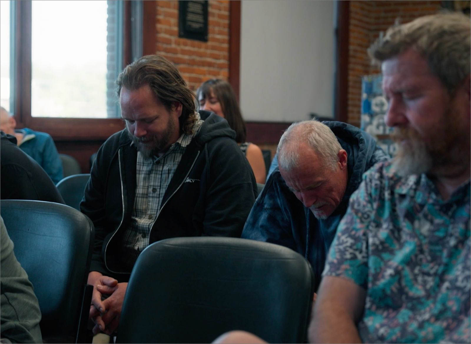 Men praying together