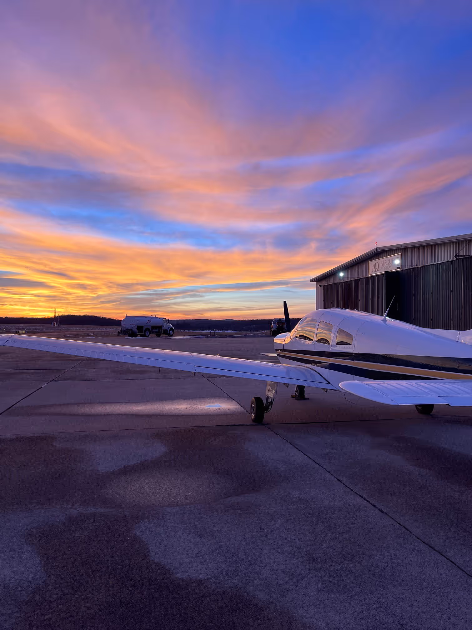 AirQuest flight school hero — student pilot and instructor preparing for takeoff