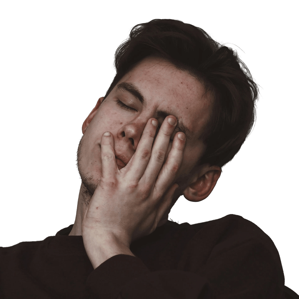 Young man in a dark shirt with eyes closed touching his face with his hand, expressing tiredness or stress.