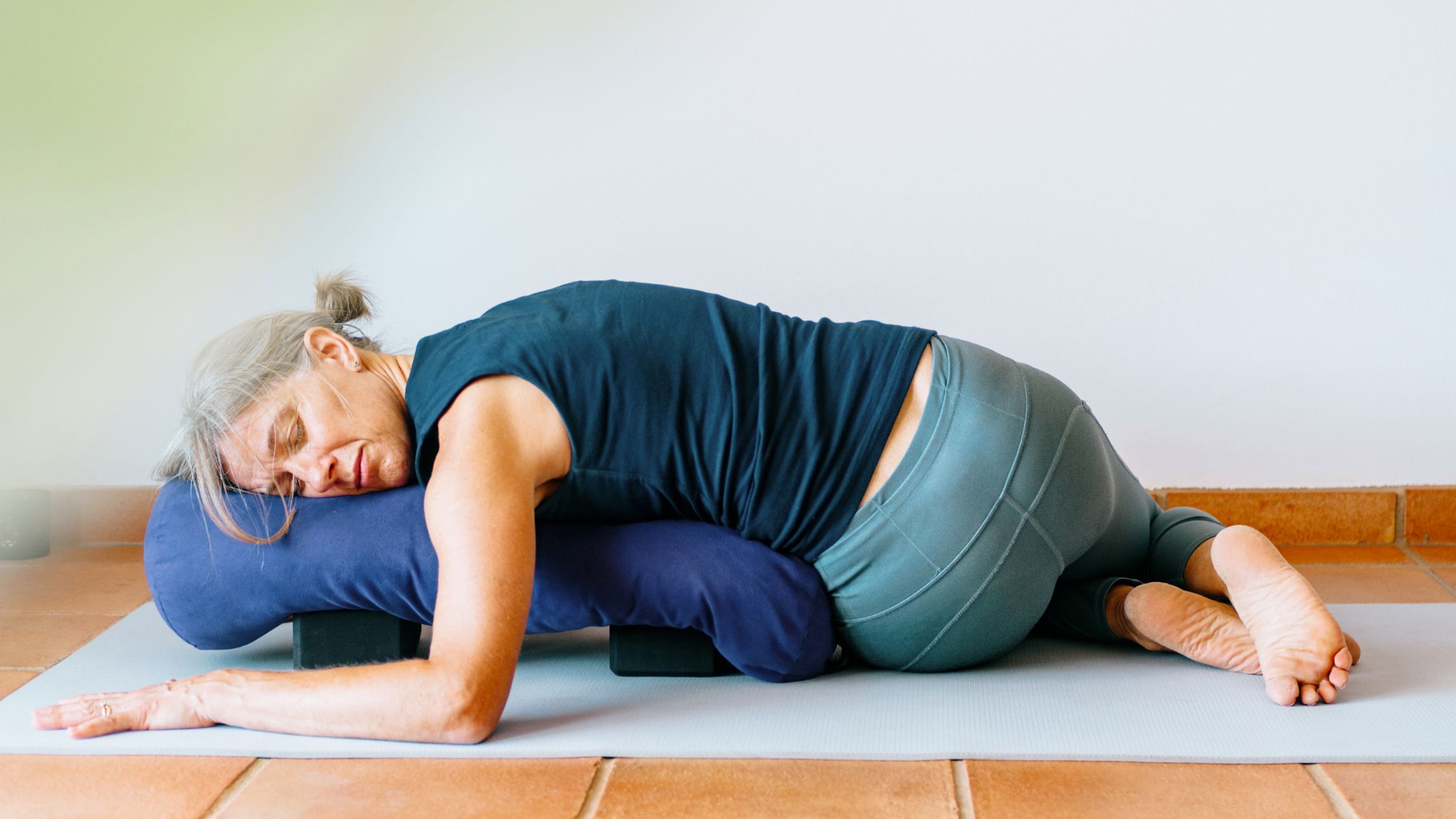Restorative yoga pose with props