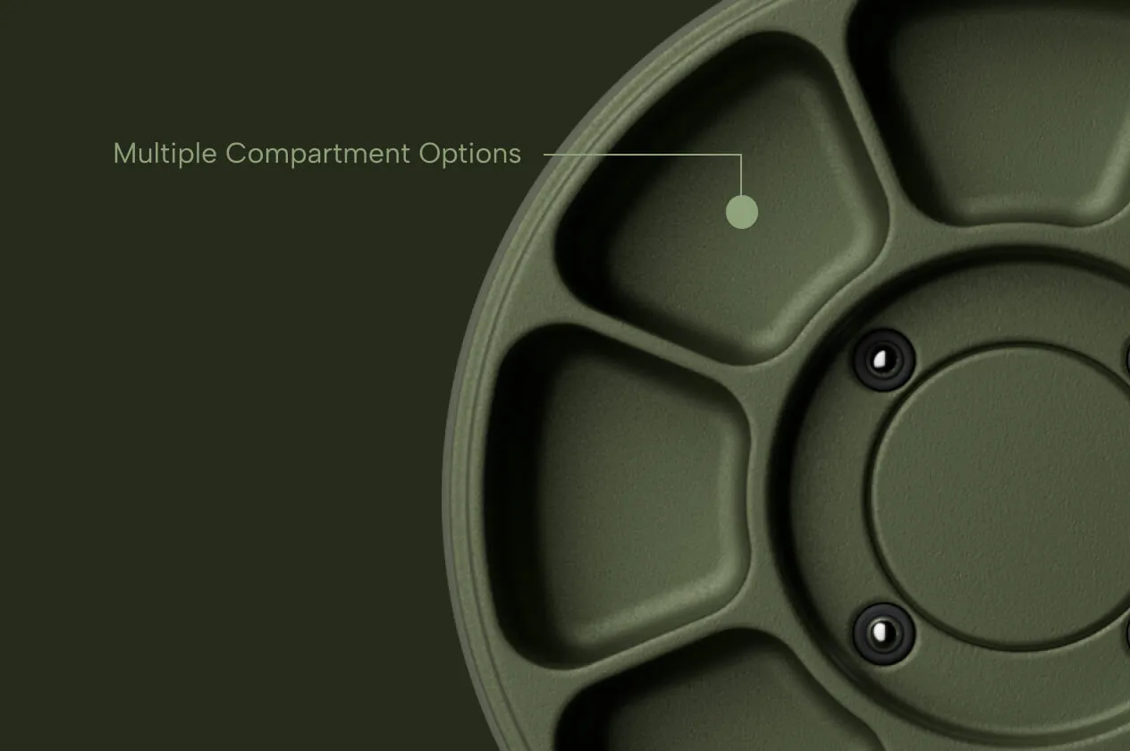 Close-up of a green circular tray with multiple segmented compartments.
