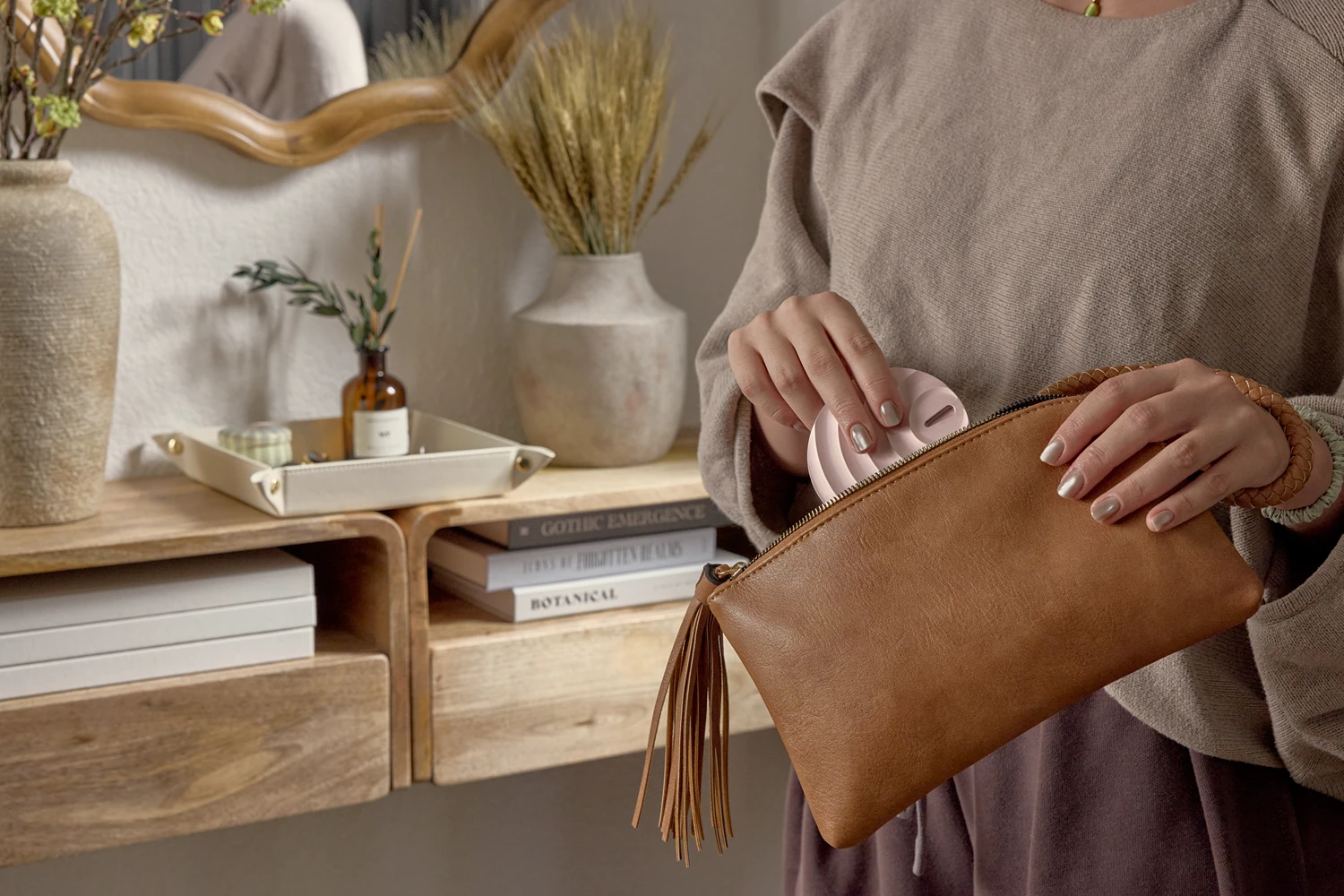 Woman pulling pill case out of her purse