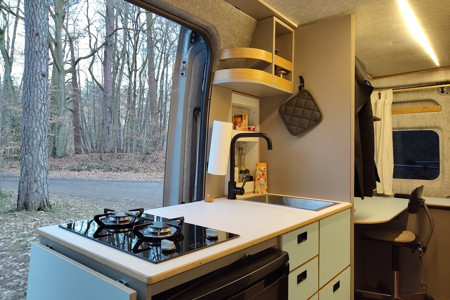 view of the kitchen module from the side with the worktop extension folded